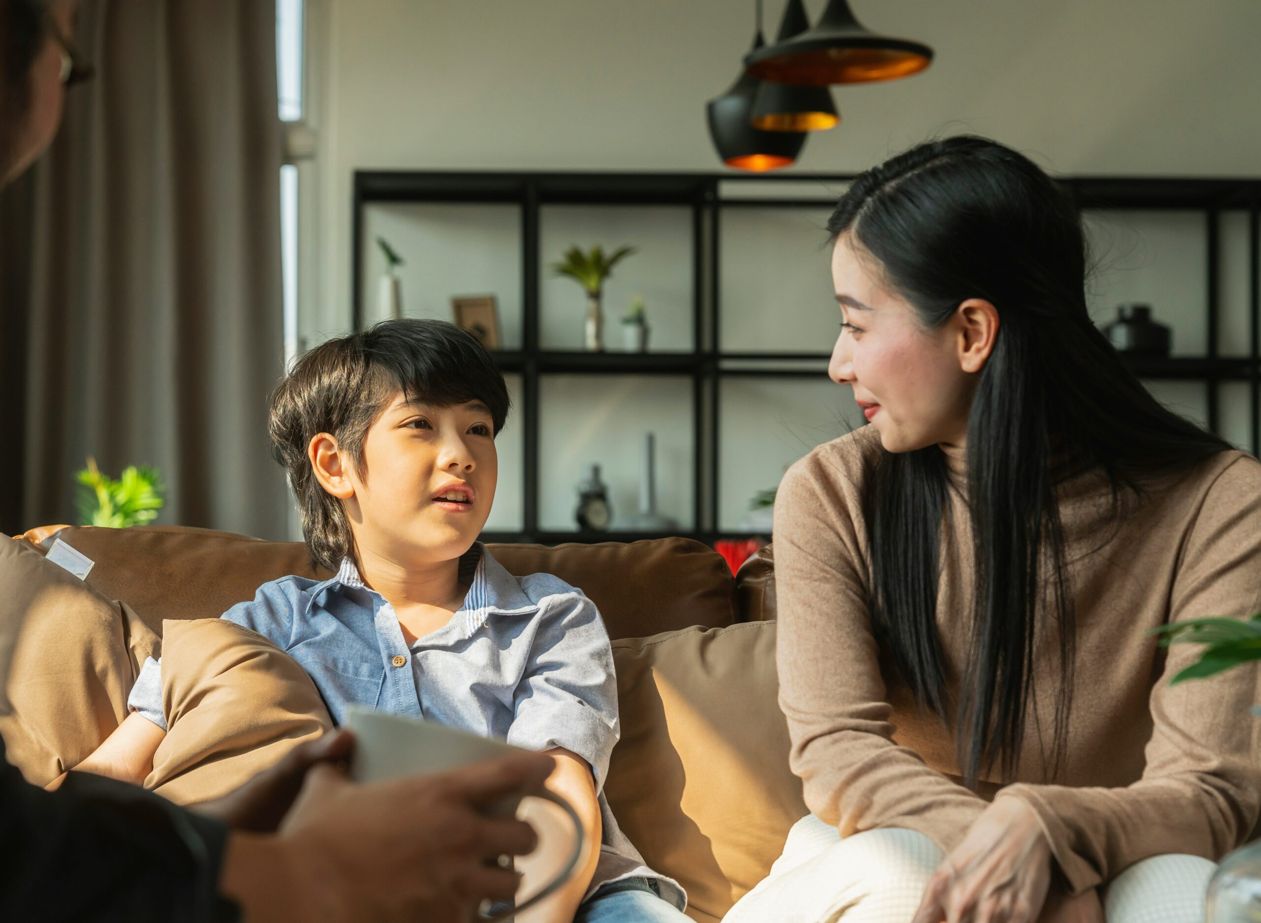 Young boy talking with an adult woman